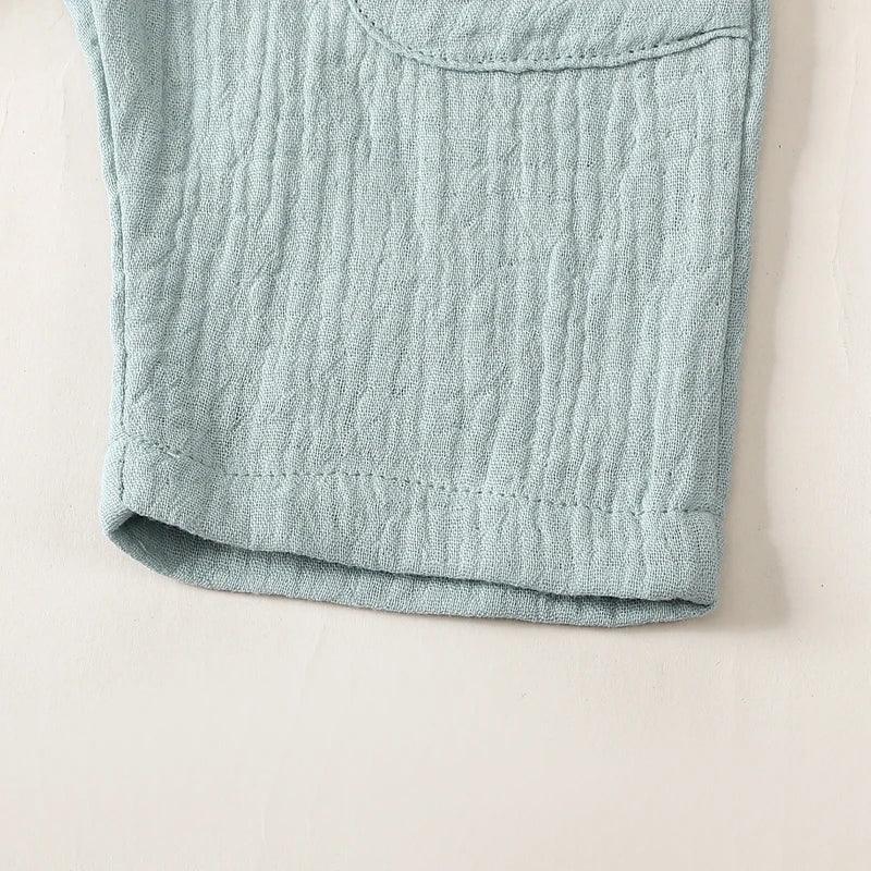 Light blue cotton kids overalls romper for toddlers with textured fabric detail