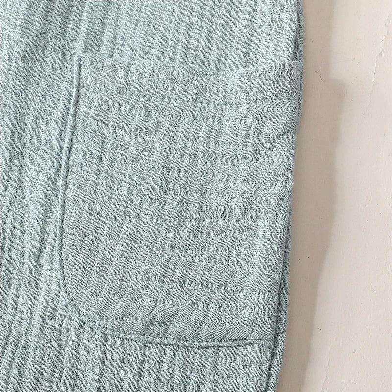 light blue cotton kids overalls romper pocket detail soft textured fabric