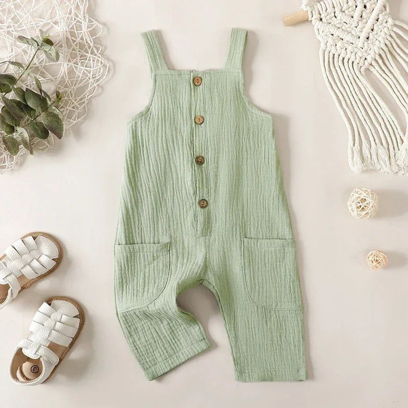 Light green cotton kids overalls romper for toddlers with front buttons and patch pockets
