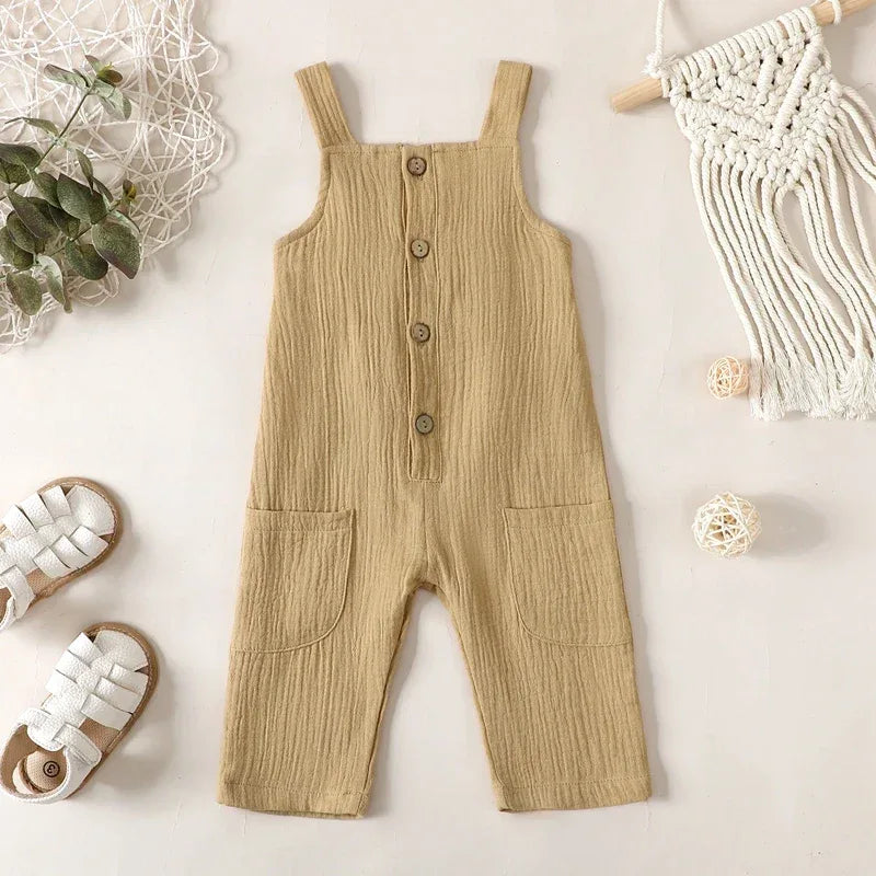 tan cotton kids overalls romper for toddlers with button front and front pockets