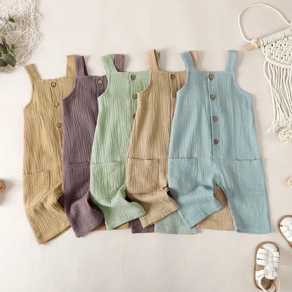 Cotton kids overalls romper in pastel colors for toddlers with front pocket and button details