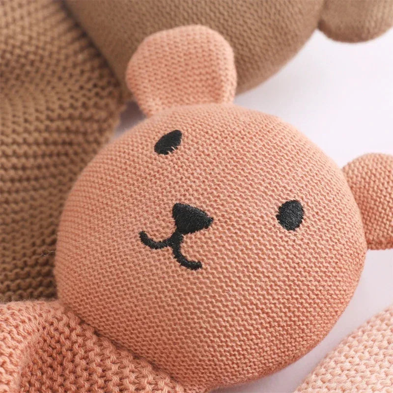 Peach cotton soothing cloth toy for toddlers with bear face and soft knitted texture
