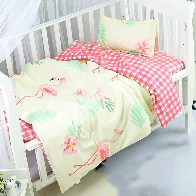 Pink and cream crib bedding set with flamingo and floral print for babies and kids