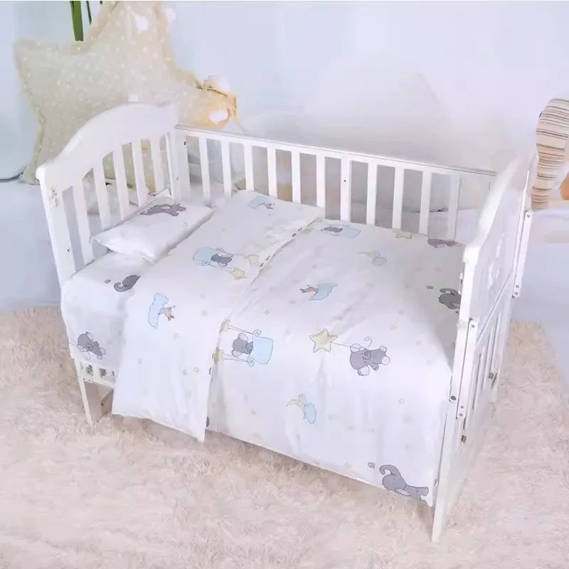 White baby crib with pastel animal print crib bedding set for newborns and infants