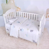 White baby crib with pastel animal print crib bedding set for newborns and infants