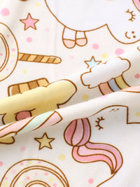 Close-up of fabric with cartoonish unicorn and cloud pattern