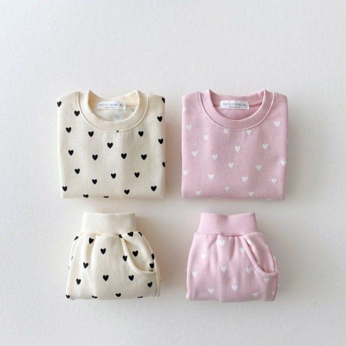 Babies warm up set in cream and pink with heart prints, long sleeve tops and pants for toddlers