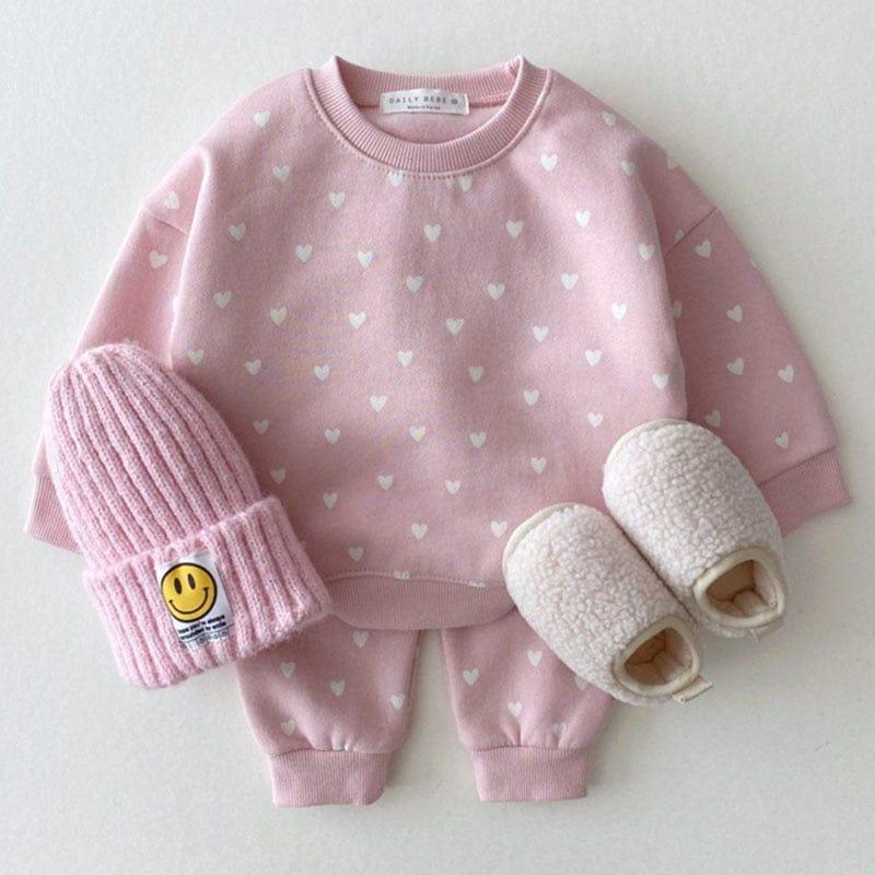 babies pink warm up set with white heart pattern, long sleeve sweatshirt and pants