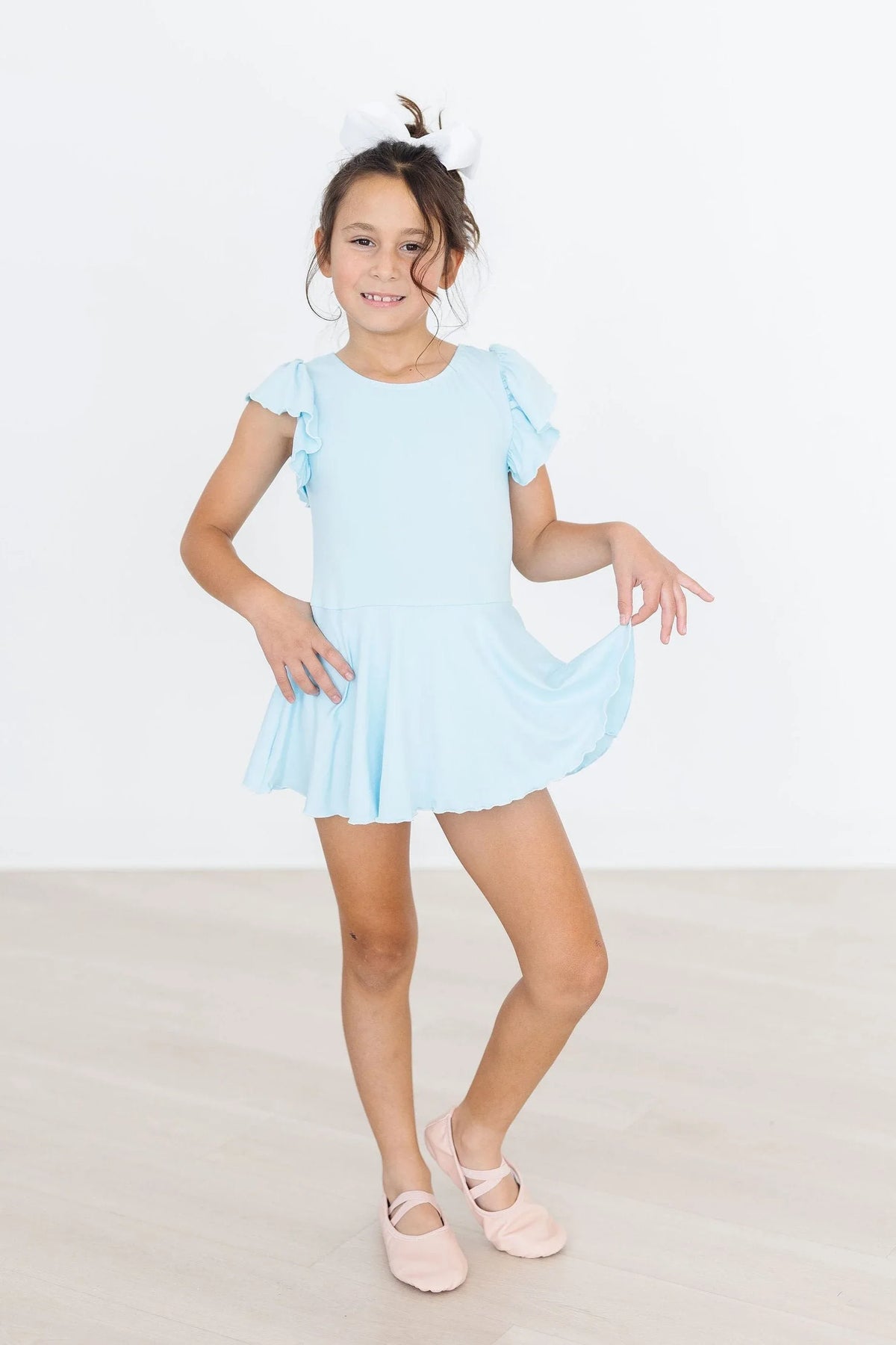 Girls light blue short sleeve twirl dance leotard with ruffle details by Mila & Rose
