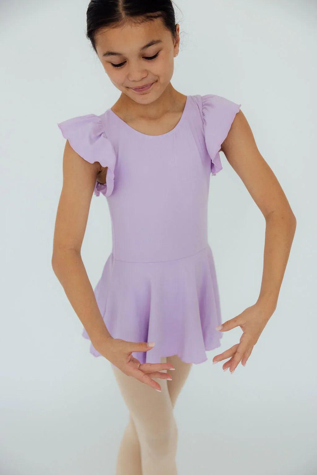 Girls lavender short sleeve twirl dance leotard with ruffle sleeves and skirt detail