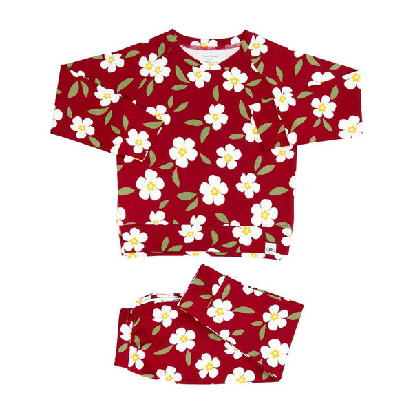 Red floral kids crew neck jogger set with white flowers, green leaves, and matching pants for cozy all-day comfort.