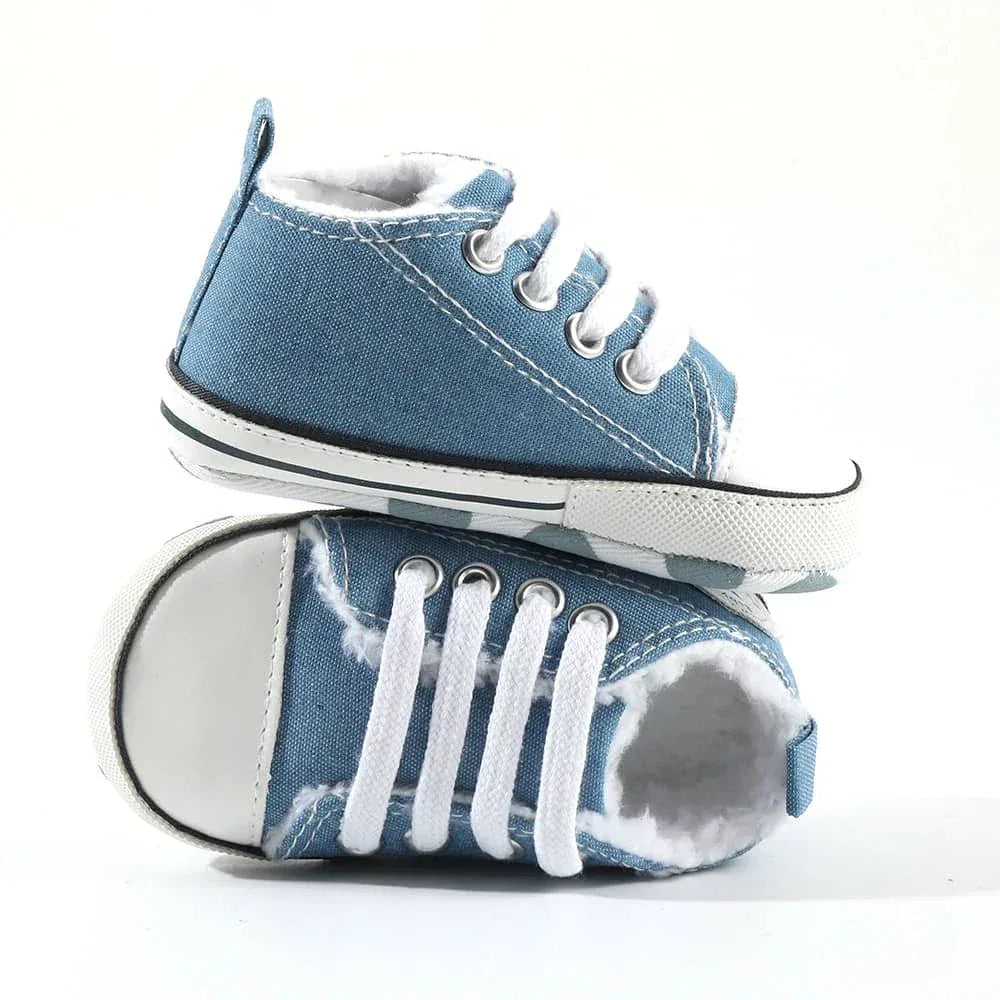 blue denim baby first walkers with white laces and rubber soles for infants