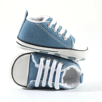 blue denim baby first walkers with white laces and rubber soles for infants