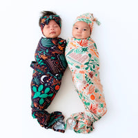 Two babies swaddled in The Forever Swaddle Blanket Desert Cactus Midnight, showcasing bold cactus prints.