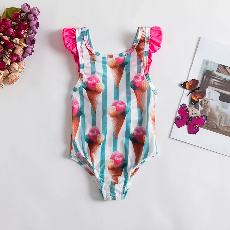 Girls dessert themed baby swimsuit with pink ice cream cone print and ruffled pink sleeves for infants