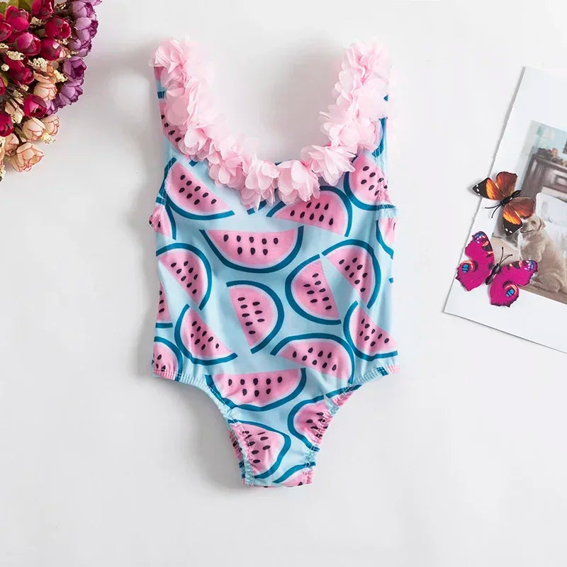 dessert themed baby swimsuit with pink watermelon print and pink floral ruffle straps for toddlers