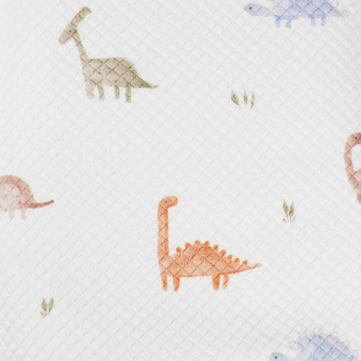 White dinosaur knit baby blanket for newborns with colorful dinosaur patterns in soft texture