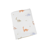 Goosewaddle dinosaur knit baby blanket in white with colorful dinosaur patterns for newborns