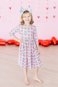 Girls pink and gray disco bow twirl dress for girls with 3/4 sleeves and pocket detail