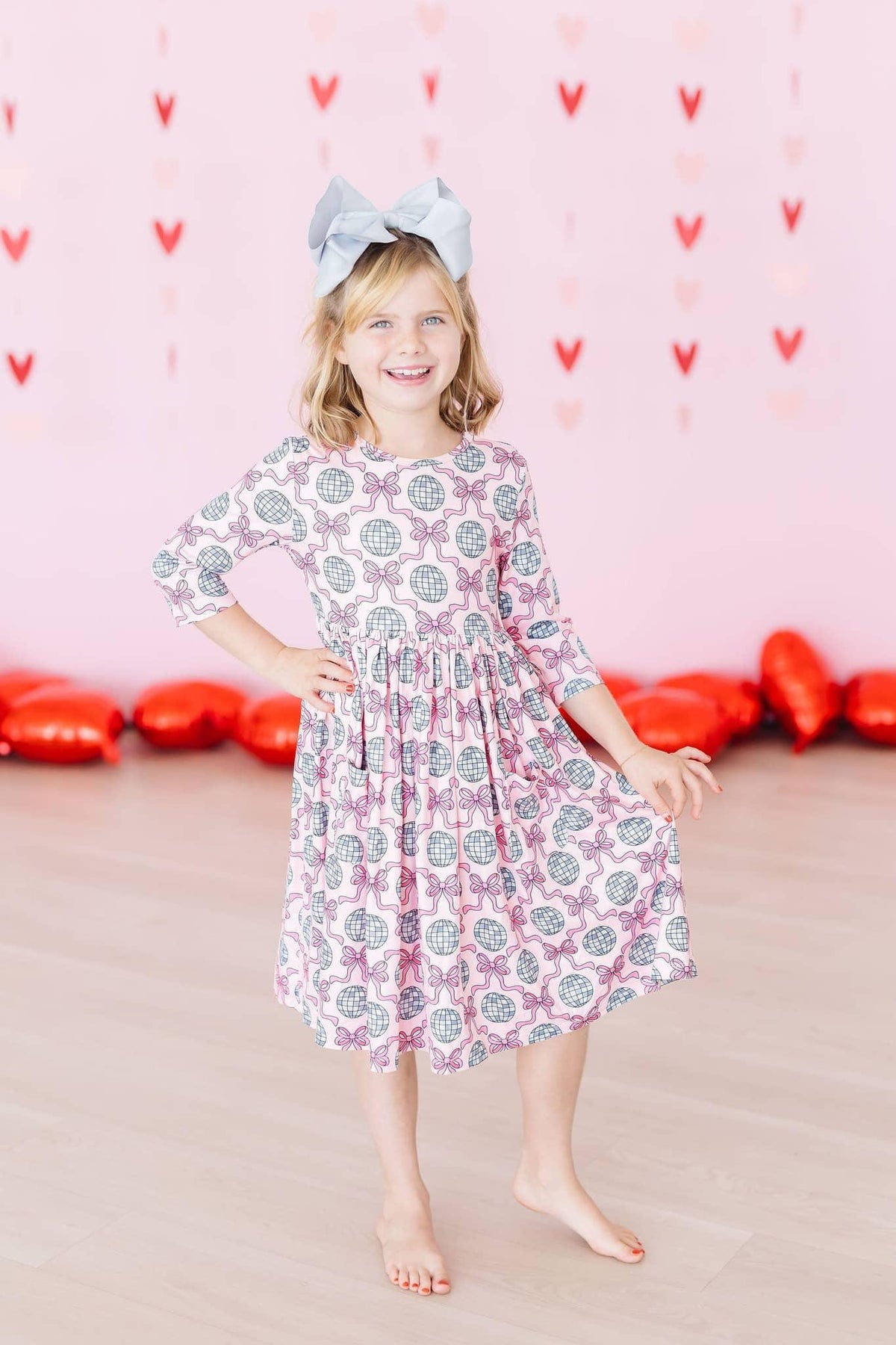 Girls pink and gray disco bow twirl dress for girls with 3/4 sleeves and pocket by Mila Rose