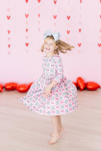 Girls pink and gray disco bow twirl dress for girls with 3/4 sleeves and floral pattern