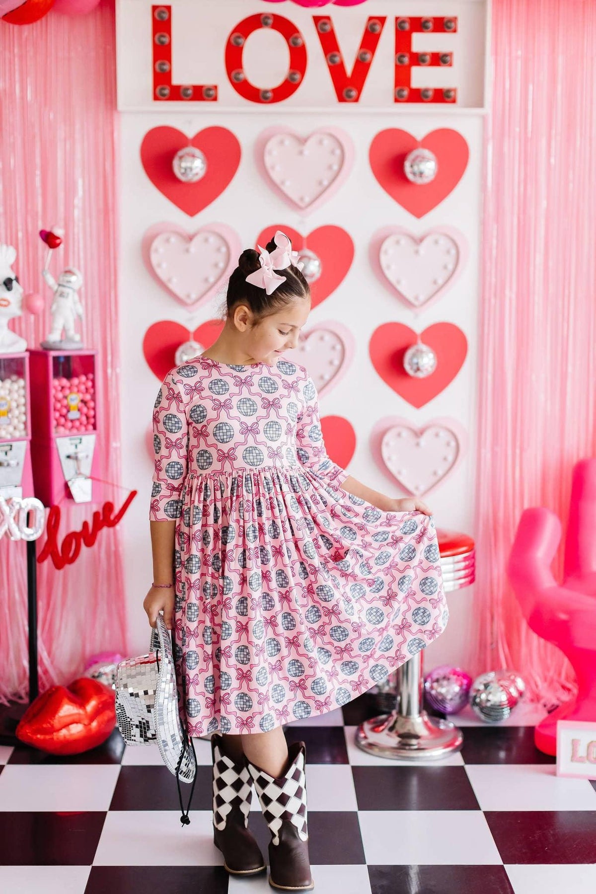 Girls pink and white disco bow twirl dress for girls with 3/4 sleeves and floral pattern