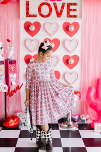 Girls pink and white disco bow twirl dress for girls with 3/4 sleeves and floral pattern