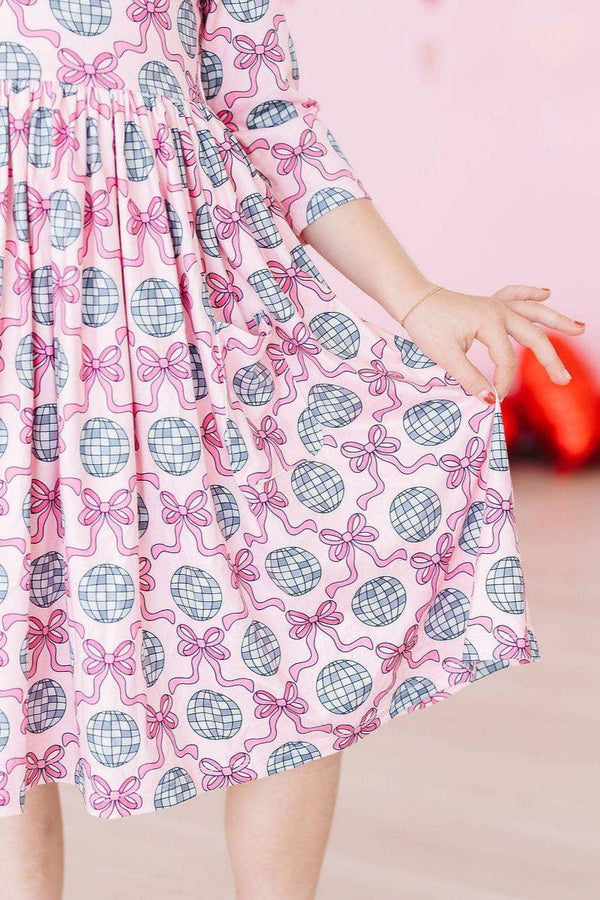 Girls pink disco bow twirl dress for girls with 3/4 sleeves and disco ball pattern