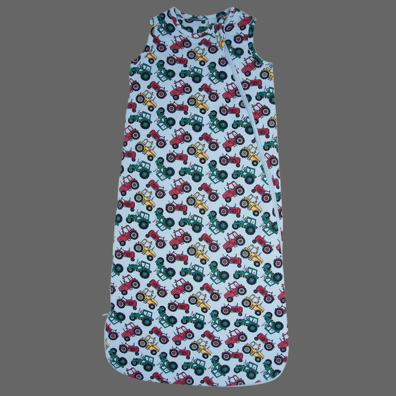 Baby romper with tractor pattern on a gray background