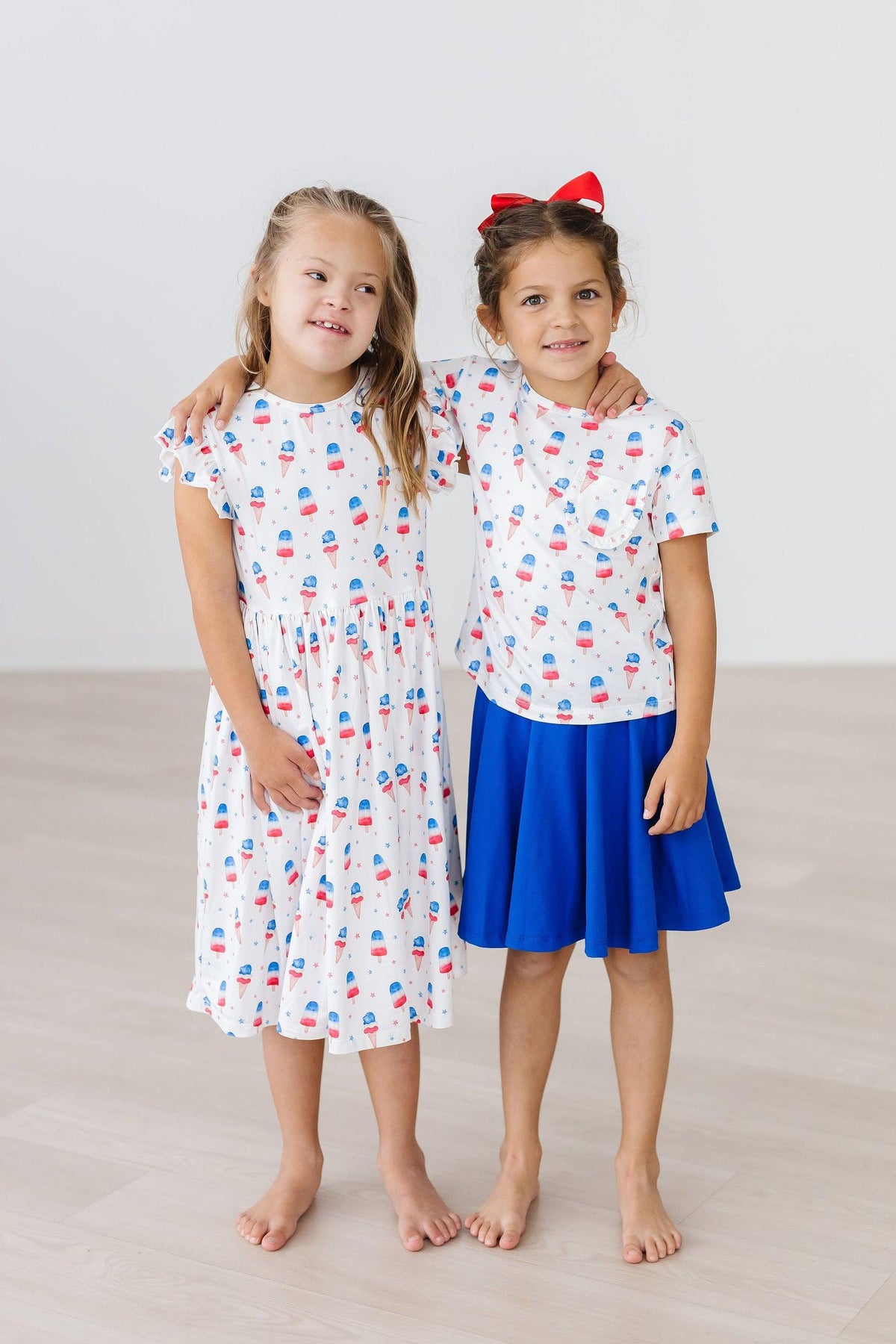 Girls white twirl dress flutter with colorful pattern and blue skirt, perfect dress for the summer
