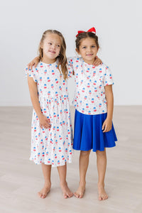 Girls white twirl dress flutter with colorful pattern and blue skirt, perfect dress for the summer