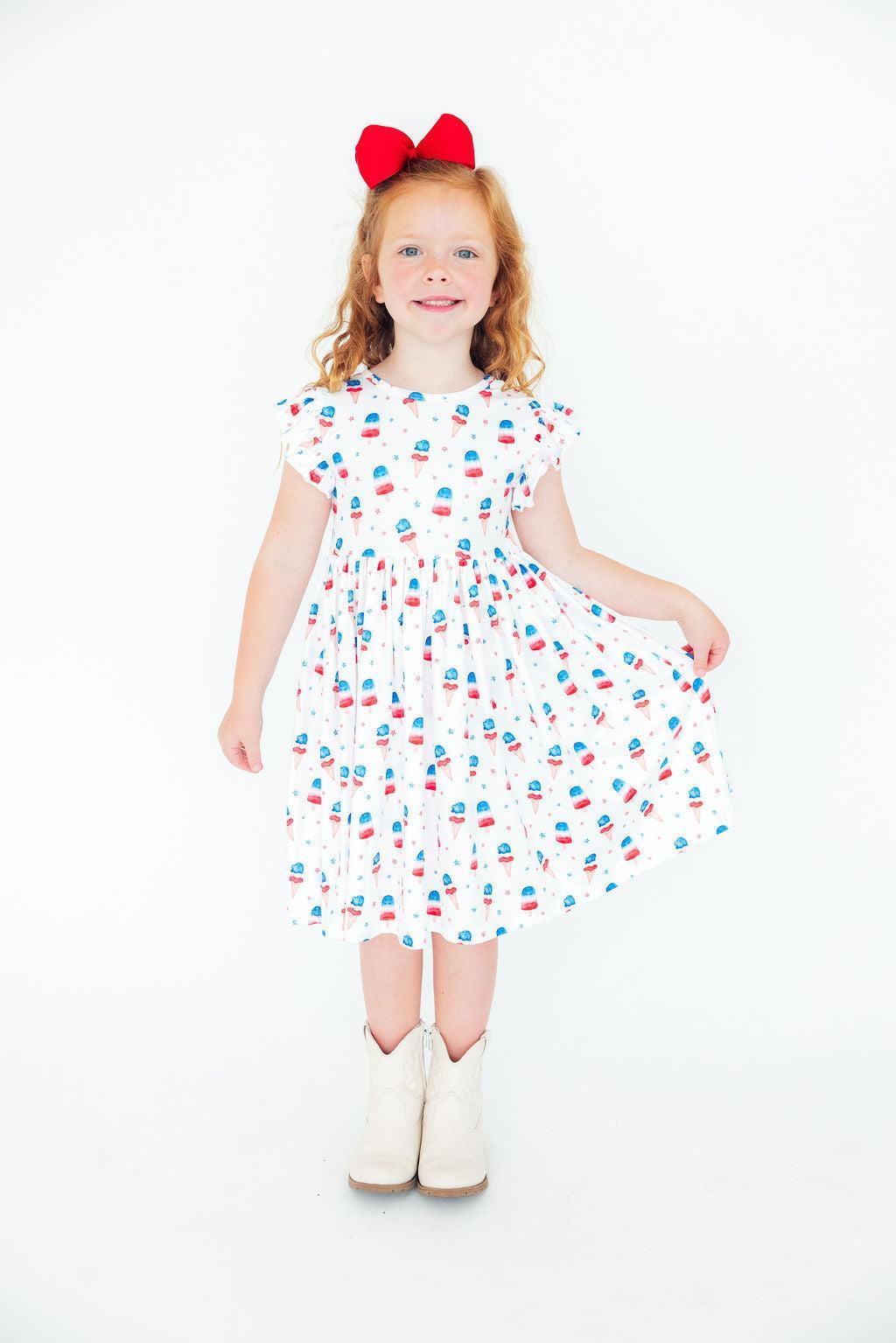 Girls white twirl dress for the summer with colorful popsicle print and flutter sleeves