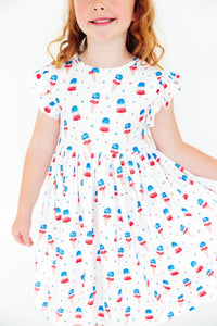 Girls white twirl dress for the summer with red blue popsicle print and flutter sleeves