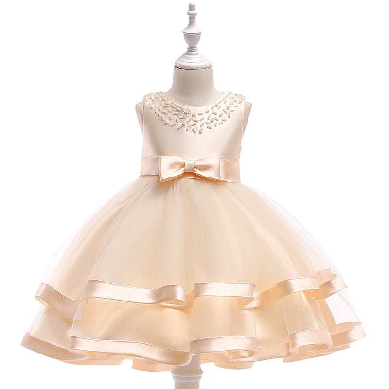 Cream-colored babies toddler special occasion dress with pearl neckline and bow, dress for wedding party guest