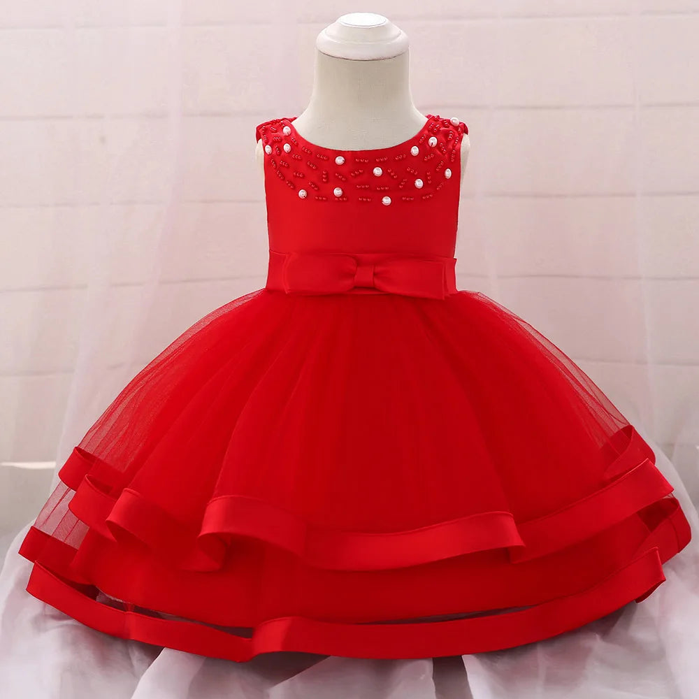 red dress for wedding party guest for babies and toddlers with pearl embellishments and bow detail
