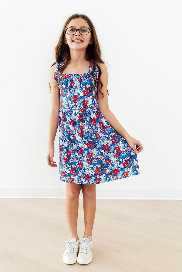 Girls blue floral ruffle cross back dress in size small with dress ruffle detail