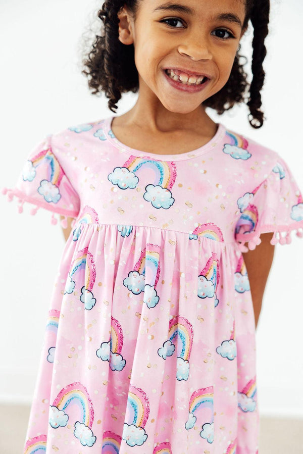 toddler girls pink pom pom dress with rainbows and cloud print dress with rainbow pattern
