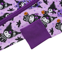 Macro shot of soft purple fabric texture, fold-over mitten cuff, and nearby skeleton character print