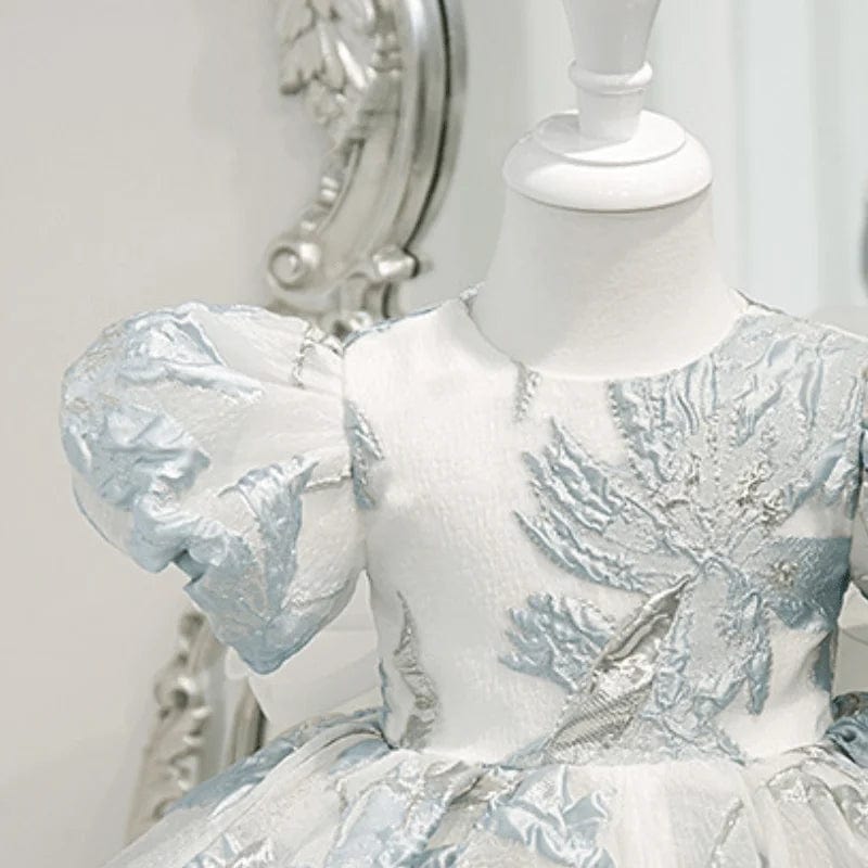 Elegant little girls brocade dress in white and light blue with puffed short sleeves for infants