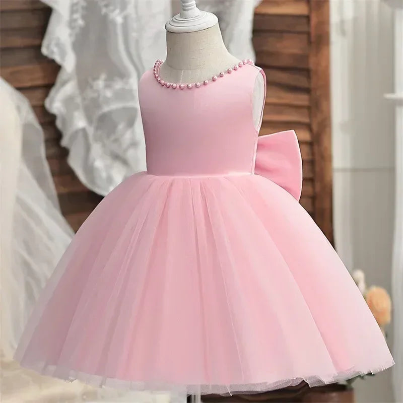 girls pink elegant V back dress for girls with pearl neckline and large back bow