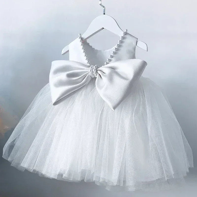 elegant V-back dress for girls white tulle skirt with large satin bow and pearl straps