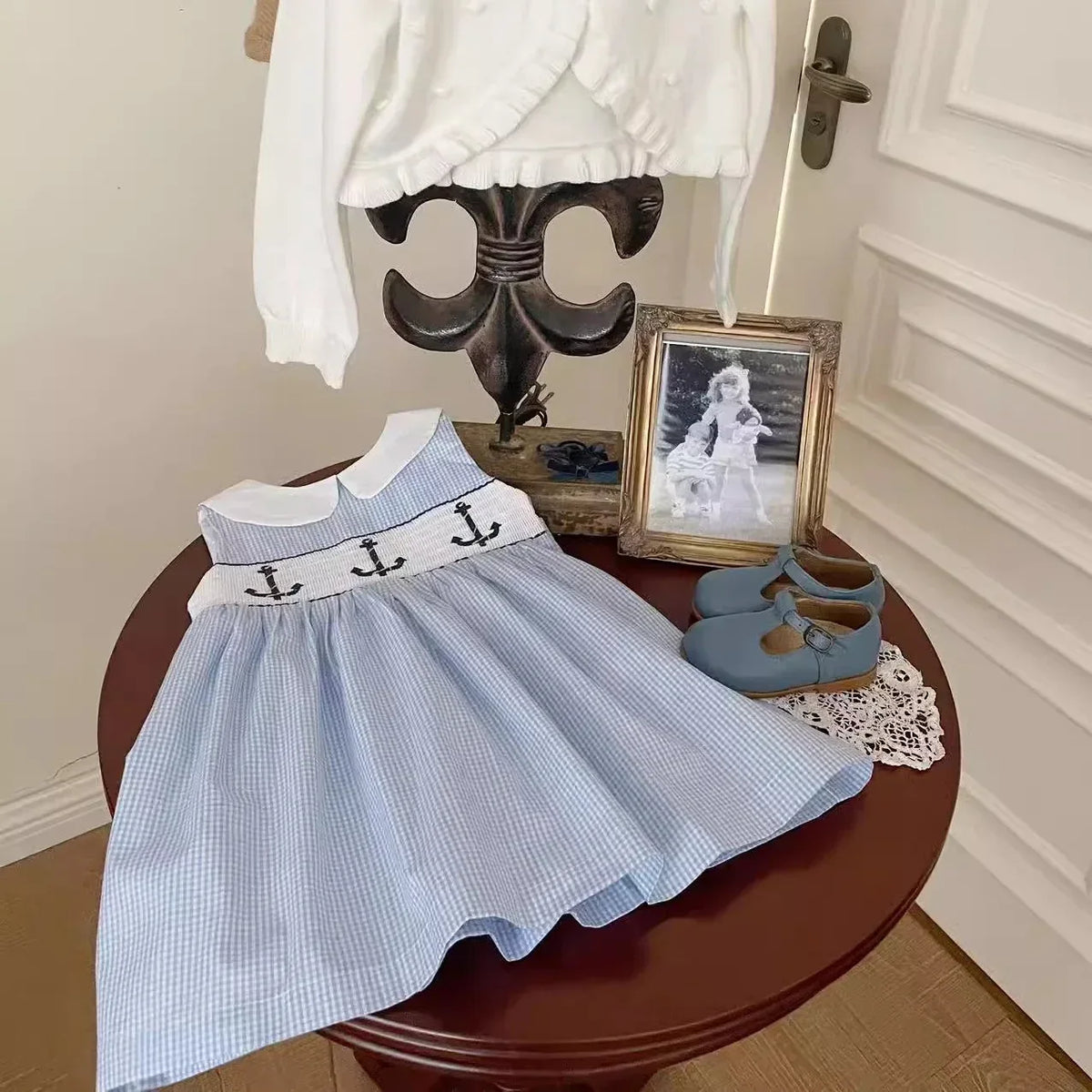 blue and white embroidered girls party dress with anchor design for toddler aged 18 to 24 months