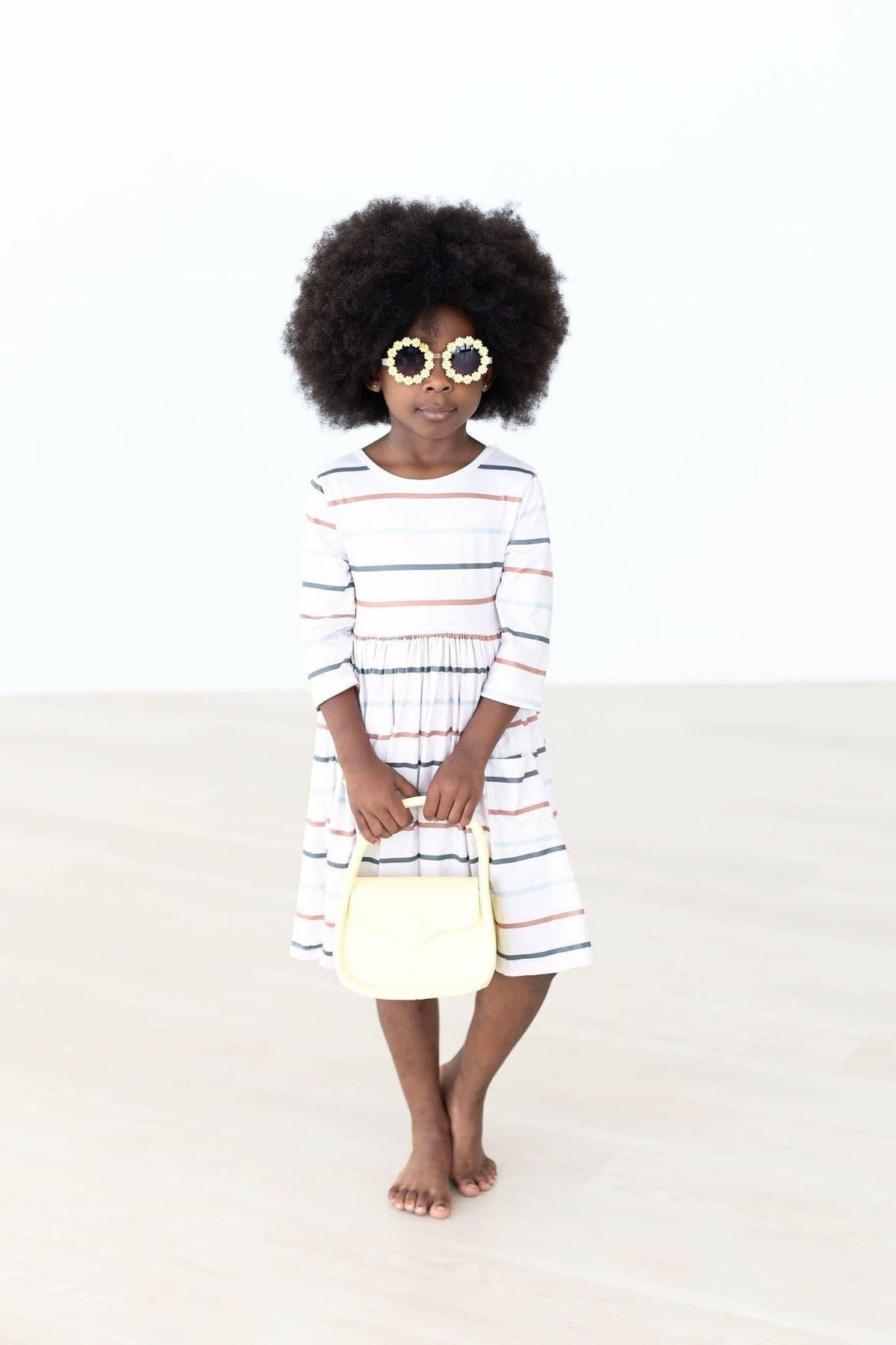 Girls fall striped twirl dress by Mila & Rose with 3/4 sleeves in white with multicolor stripes