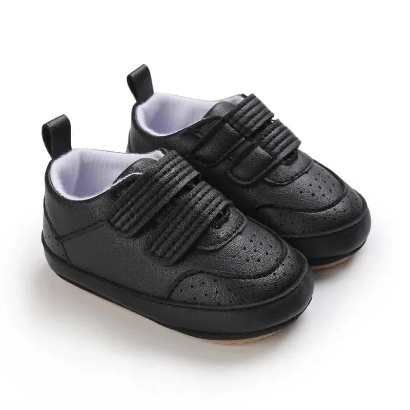 Black faux leather baby shoes for infants with Velcro straps for easy wear