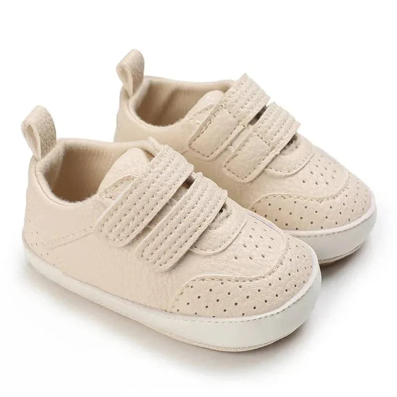 beige faux leather baby shoes for infants with velcro straps and perforated details