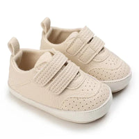 beige faux leather baby shoes for infants with velcro straps and perforated details