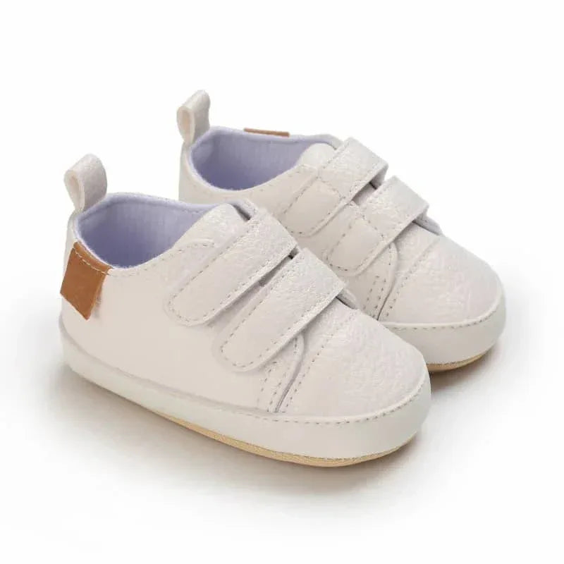 white faux leather baby shoes with double velcro straps for infants