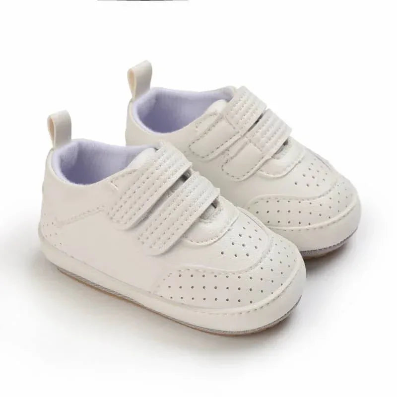 White faux leather baby shoes with double straps for infants and toddlers