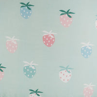 Close-up of toddler round floor cushion in pastel colors with strawberry pattern for kids