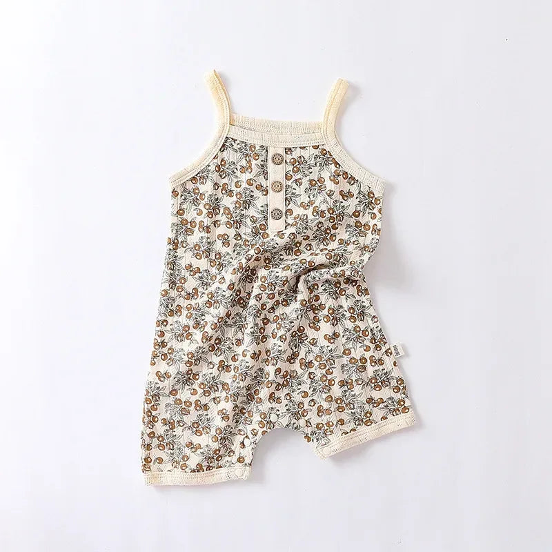 cream and brown floral baby romper with button front and sleeveless straps for infants